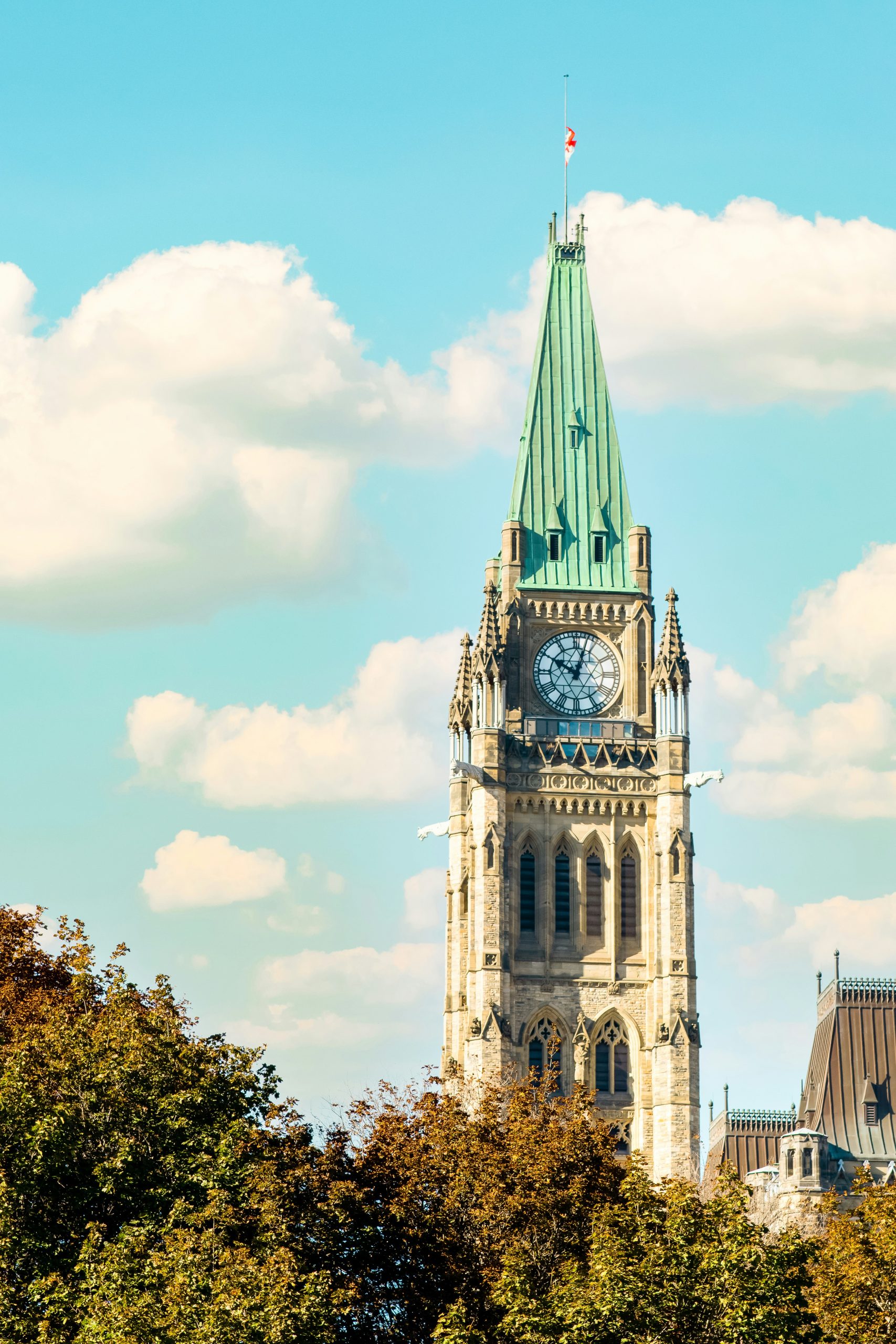 A clocktower building below a blue sky.